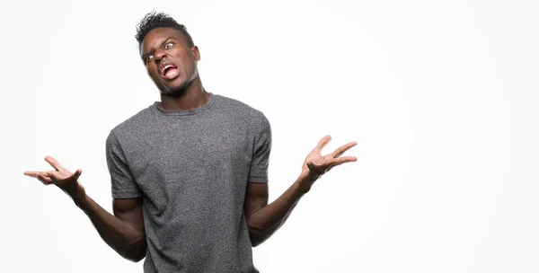 Young African American Man Wearing Grey Shirt Crazy Mad Shouting — Stock Photo, Image