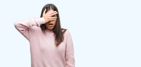 Young Beautiful Hispanic Woman Wearing Sweater Peeking Shock Covering Face — Stock Photo, Image