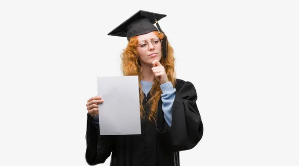 Young Redhead Woman Wearing Graduate Uniform Holding Degree Serious Face — Stock Photo, Image