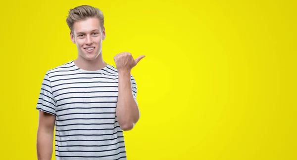 Young Handsome Blond Man Wearing Stripes Sailor Shirt Pointing Hand — Stock Photo, Image