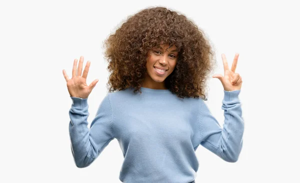 African American Woman Wearing Sweater Showing Pointing Fingers Number Eight — Stock Photo, Image