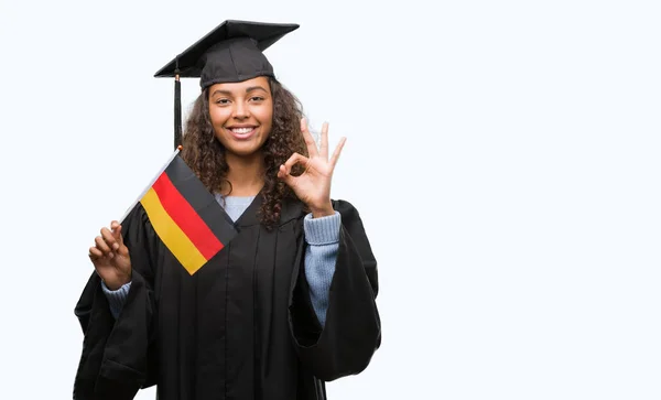 Mulher Hispânica Jovem Vestindo Uniforme Graduação Segurando Bandeira Alemanha Fazendo — Fotografia de Stock