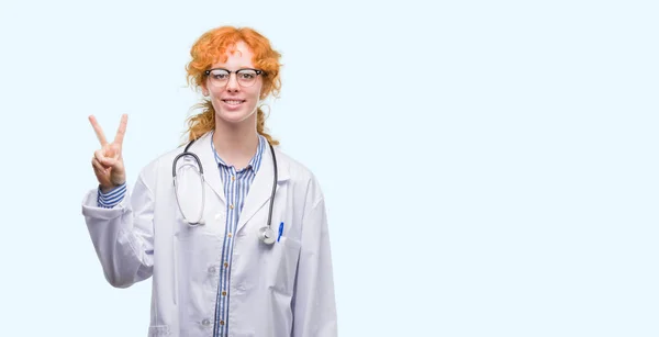 Young Redhead Woman Wearing Doctor Uniform Showing Pointing Fingers Number — Stock Photo, Image