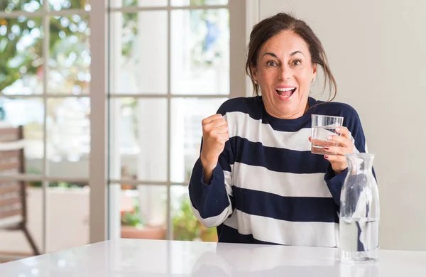 Middle Aged Woman Drinking Glass Water Screaming Proud Celebrating Victory — Stock Photo, Image