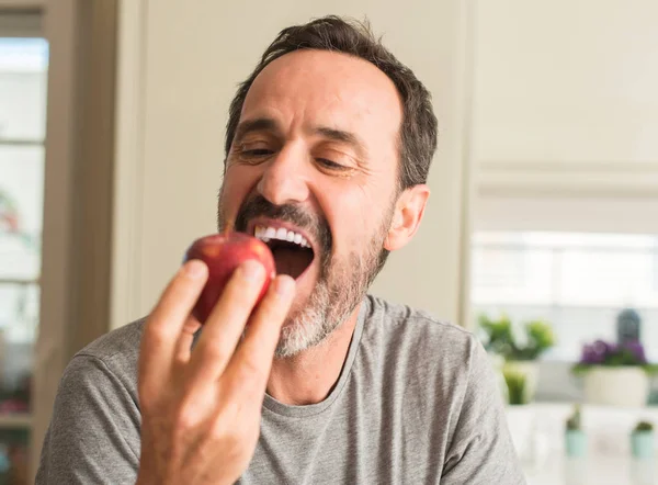 Middle Age Man Eating Healthy Red Apple Happy Face Standing — Stock Photo, Image