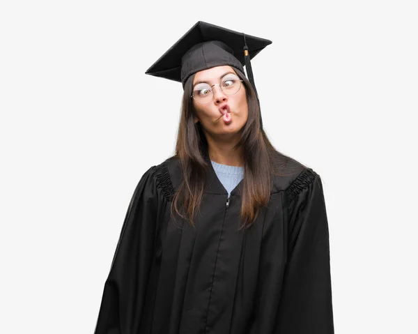 Young Hispanic Woman Wearing Graduated Cap Uniform Making Fish Face — Stock Photo, Image