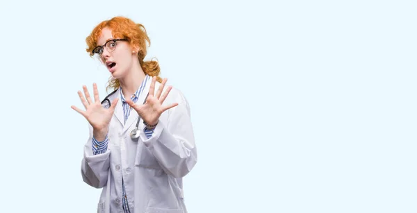 Young Redhead Woman Wearing Doctor Uniform Afraid Terrified Fear Expression — Stock Photo, Image