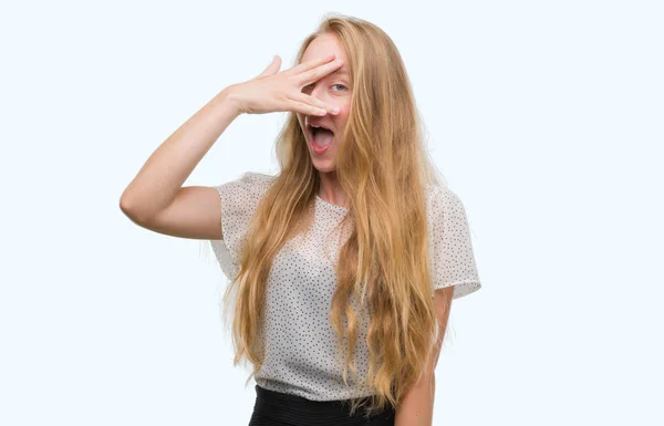 Blonde Teenager Woman Wearing Moles Shirt Peeking Shock Covering Face — Stock Photo, Image