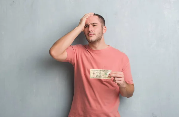 Young Caucasian Man Grey Grunge Wall Showing Ten Dollars Stressed — Stock Photo, Image