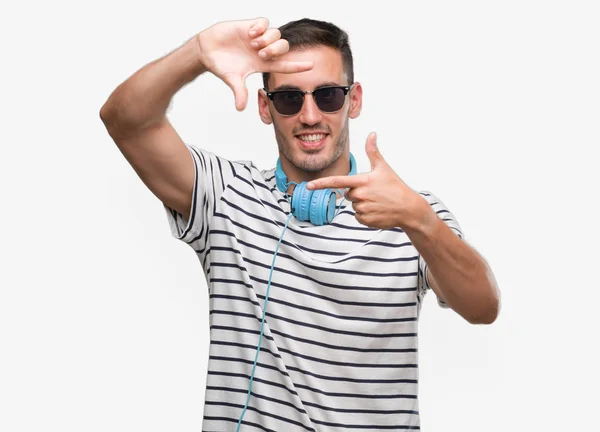 Handsome Young Man Wearing Headphones Smiling Making Frame Hands Fingers — Stock Photo, Image