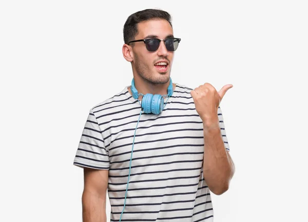 Handsome Young Man Wearing Headphones Smiling Happy Face Looking Pointing — Stock Photo, Image
