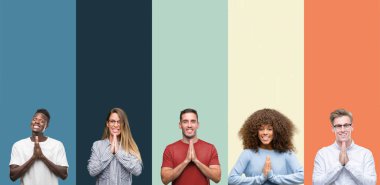 Group of people over vintage colors background praying with hands together asking for forgiveness smiling confident. clipart