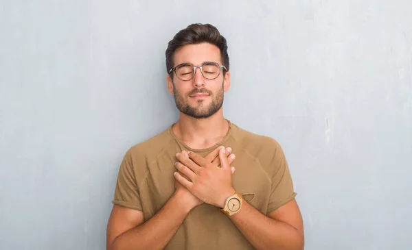 Handsome Young Man Grey Grunge Wall Wearing Glasses Smiling Hands — Stock Photo, Image