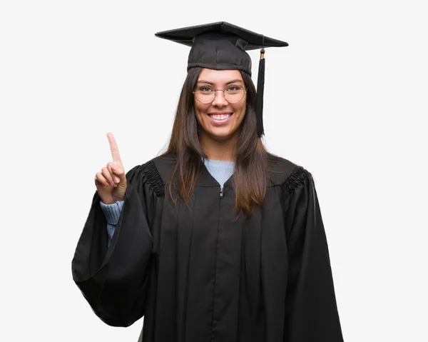 Young Hispanic Woman Wearing Graduated Cap Uniform Showing Pointing Finger — Stock Photo, Image