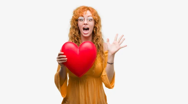 Joven Pelirroja Enamorada Sosteniendo Corazón Rojo Muy Feliz Excitada Expresión — Foto de Stock