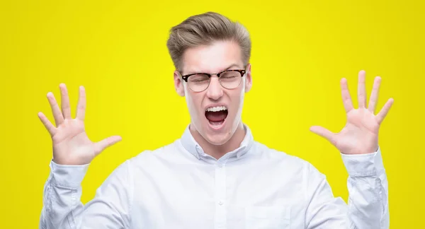 Young Handsome Blond Man Celebrating Mad Crazy Success Arms Raised — Stock Photo, Image