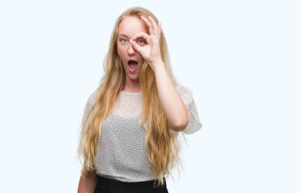 Blonde Teenager Woman Wearing Moles Shirt Doing Gesture Shocked Surprised — Stock Photo, Image