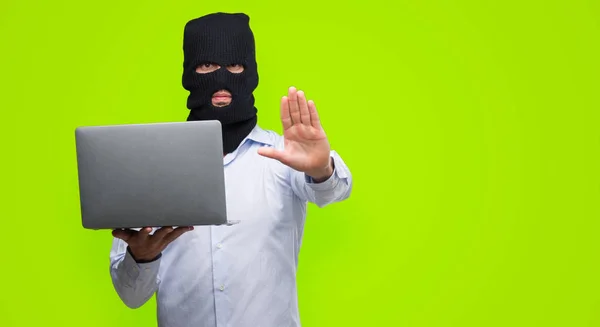 Business Hacker Man Holding Computer Laptop Open Hand Doing Stop — Stock Photo, Image