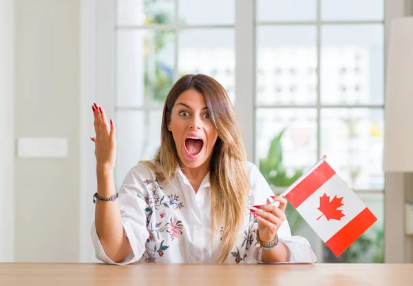 Jovem Mulher Casa Segurando Bandeira Canadá Muito Feliz Animado Expressão — Fotografia de Stock