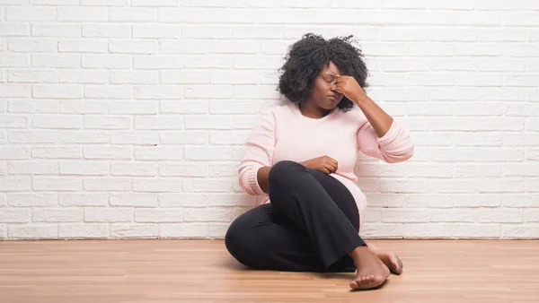 Young African American Woman Sitting Floor Home Tired Rubbing Nose — Stock Photo, Image