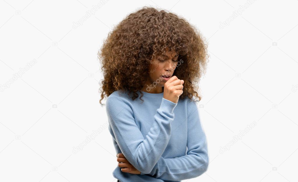 African american woman wearing a sweater feeling unwell and coughing as symptom for cold or bronchitis. Healthcare concept.