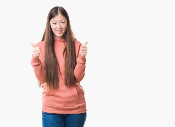 Joven Mujer China Sobre Fondo Aislado Con Sudadera Deportiva Signo — Foto de Stock