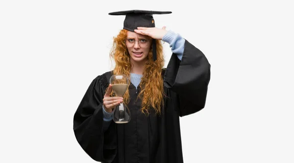 Young Redhead Student Woman Wearing Graduated Uniform Holding Hourglass Stressed — Stock Photo, Image