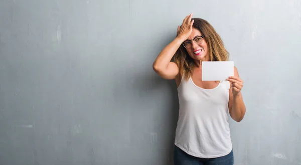 Middle Age Hispanic Woman Standing Grey Grunge Wall Holding Blank — Stock Photo, Image