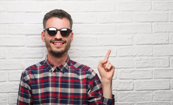 Young Adult Man Wearing Sunglasses Standing White Brick Wall Very — Stock Photo, Image