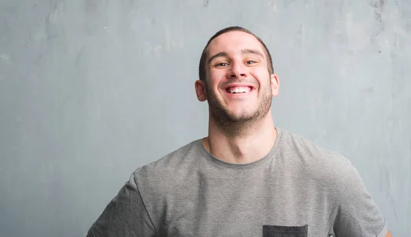 Young Caucasian Man Grey Grunge Wall Happy Face Standing Smiling — Stock Photo, Image