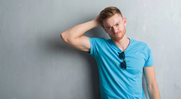Young Redhead Man Grey Grunge Wall Wearing Casual Outfit Confuse — Stock Photo, Image