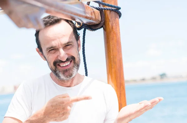 Handsome Senior Man Traveling Sailboat Very Happy Pointing Hand Finger — Stock Photo, Image