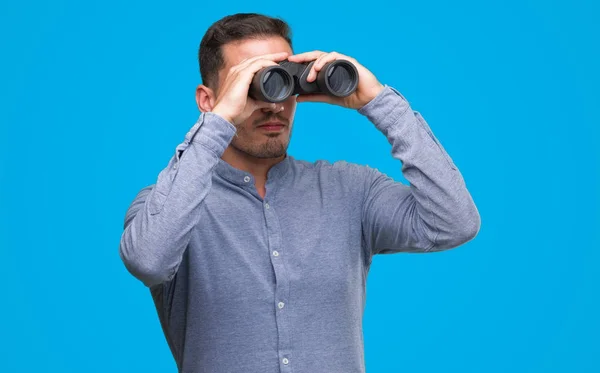 Handsome Young Man Looking Binoculars Confident Expression Smart Face Thinking — Stock Photo, Image