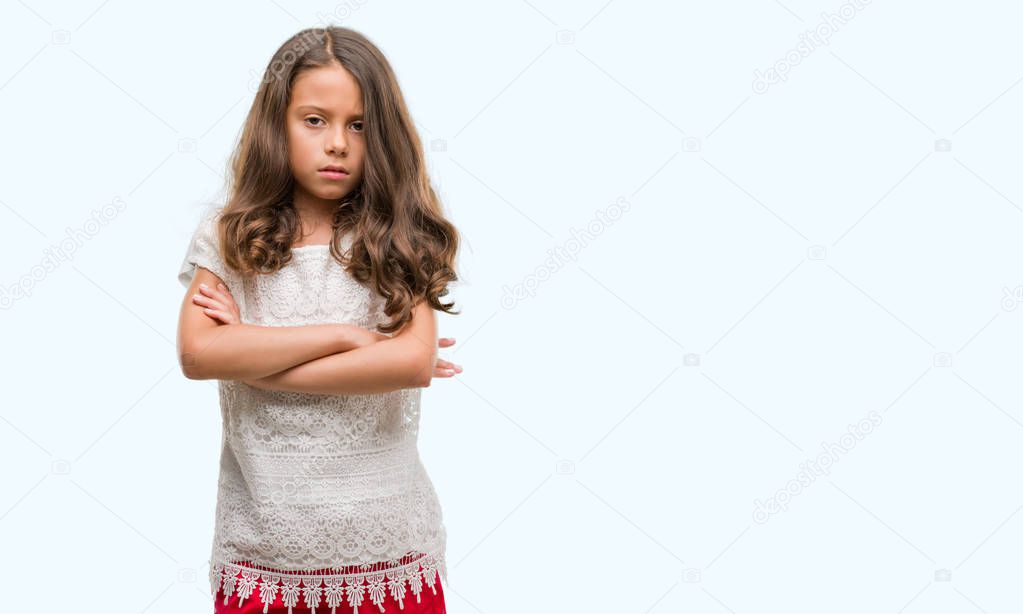 Brunette hispanic girl skeptic and nervous, disapproving expression on face with crossed arms. Negative person.