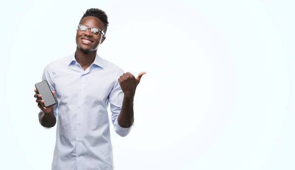 Young African American Man Using Smartphone Pointing Hand Finger Happy — Stock Photo, Image