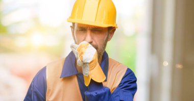 Senior engineer man, construction worker sick and coughing, suffering asthma or bronchitis, medicine concept clipart
