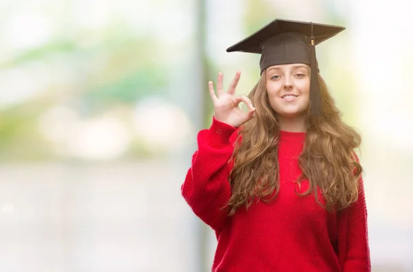 Young Blonde Woman Wearing Graduation Cap Doing Sign Fingers Excellent — Stock Photo, Image