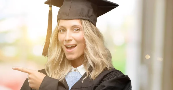 Young Graduate Woman Pointing Away Side Finger — Stock Photo, Image