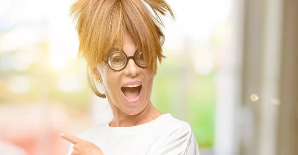 Crazy Middle Age Woman Wearing Silly Glasses Pointing Away Side — Stock Photo, Image