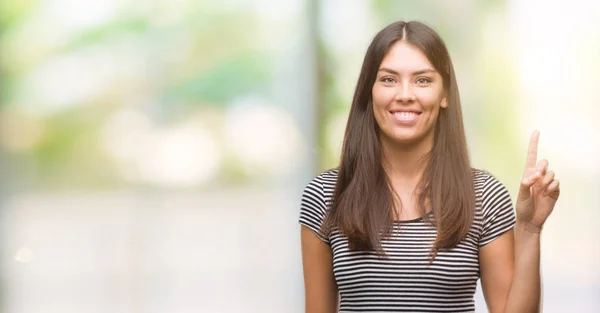 Young Beautiful Hispanic Woman Showing Pointing Finger Number One While — Stock Photo, Image