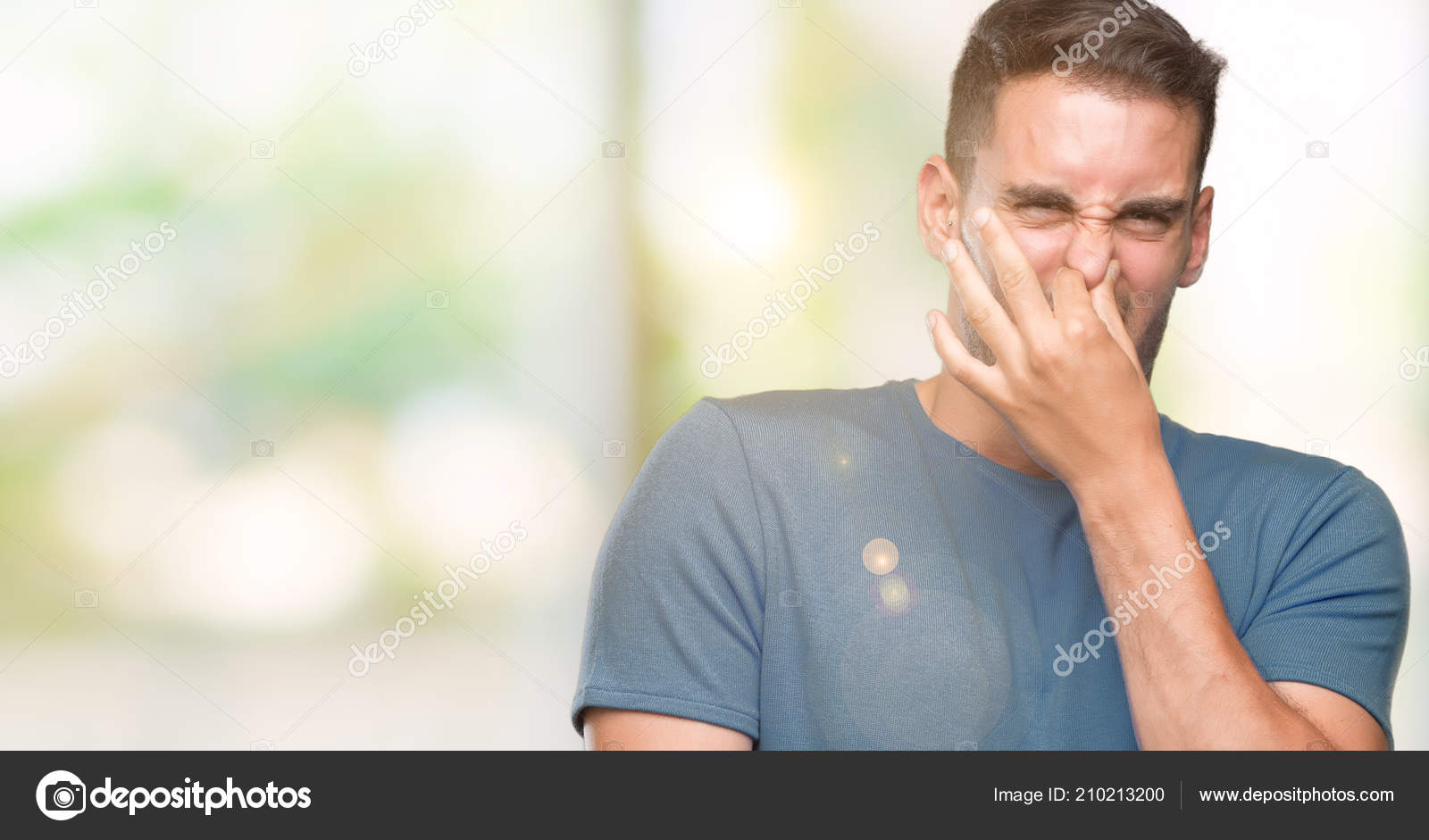 Handsome Young Casual Man Smelling Something Stinky Disgusting Intolerable  Smell — Stock Photo © Krakenimages.com #210213200, image size:1600x941