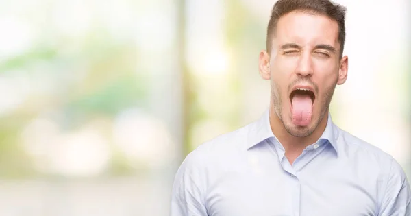 Joven Hombre Negocios Guapo Sacando Lengua Feliz Con Expresión Divertida —  Fotos de Stock