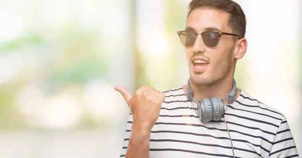 Handsome Young Man Wearing Headphones Smiling Happy Face Looking Pointing — Stock Photo, Image