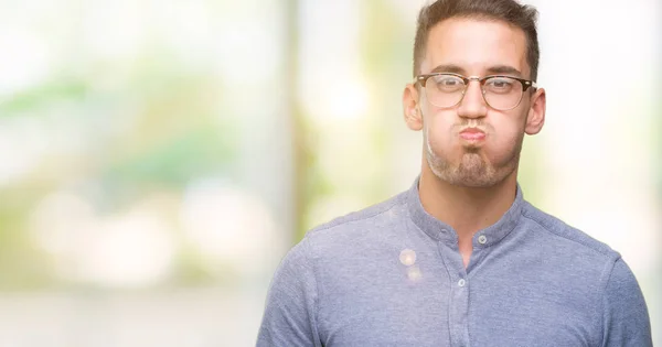 Handsome Young Elegant Man Wearing Glasses Puffing Cheeks Funny Face — Stock Photo, Image