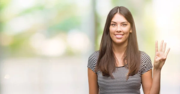 若い美しいヒスパニック女性を示すと指で上向き数は自信を持って 幸せな笑みを浮かべている間 — ストック写真