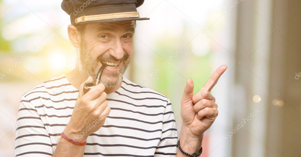 Sailor captain man smoking a tobacco pipe pointing away side with finger