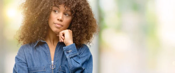 African American Woman Wearing Blue Jumpsuit Thinking Looking Expressing Doubt — Stock Photo, Image