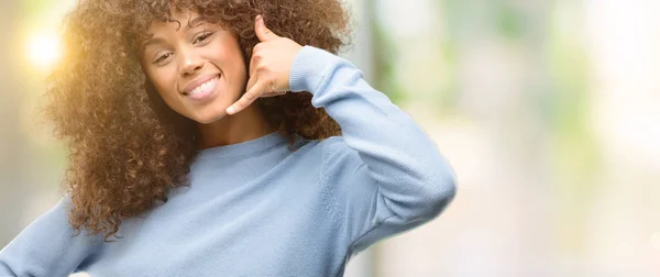 African American Woman Wearing Sweater Smiling Doing Phone Gesture Hand — Stock Photo, Image