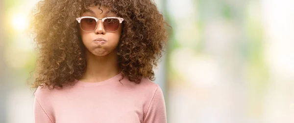 African American Woman Wearing Pink Sunglasses Puffing Cheeks Funny Face — Stock Photo, Image