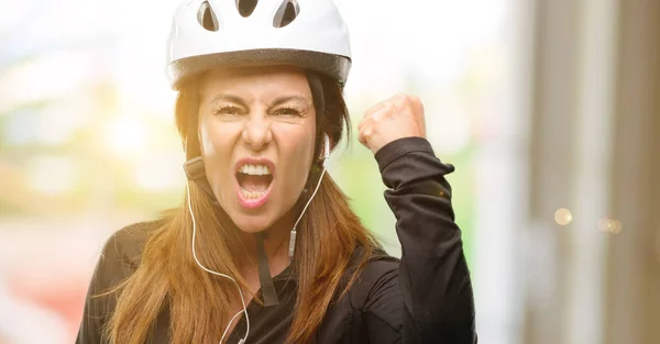 Middle Age Cyclist Woman Using Earphones Irritated Angry Expressing Negative — Stock Photo, Image